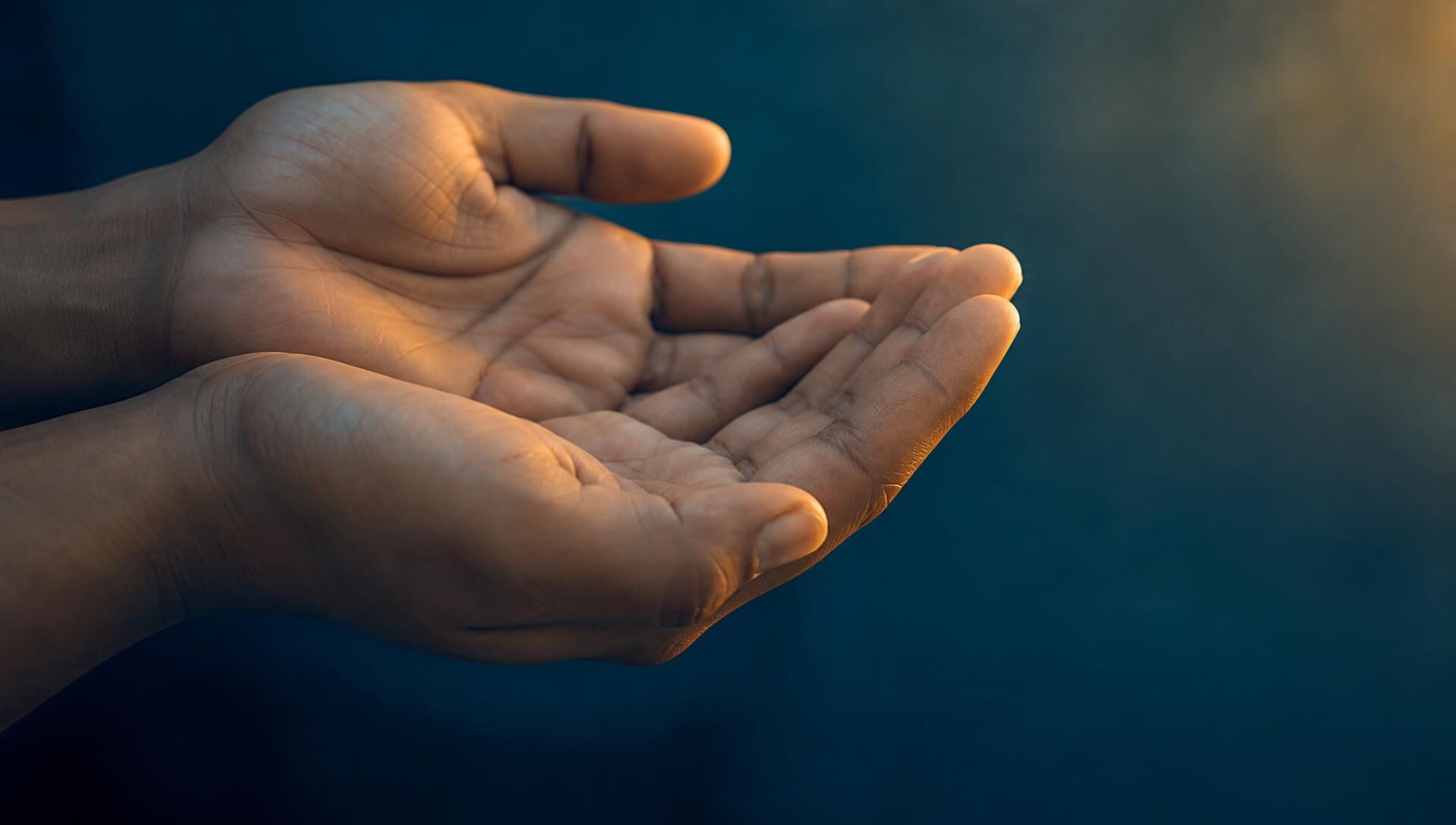 Cupped hands offering food and support
